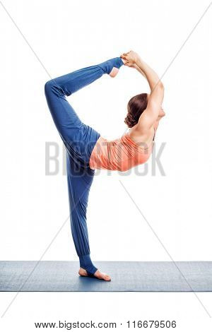 Beautiful sporty fit woman doing yoga asana Natarajasana - Lord of the dance pose advanced variation isolated on white