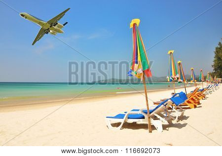 Row of sun beds at Bang Tao beach of Phuket island