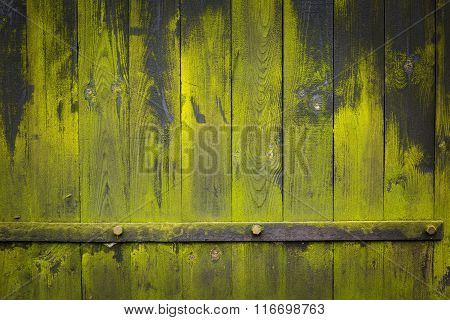 Dark Wooden Wall Background With Green Lichens And Iron Element
