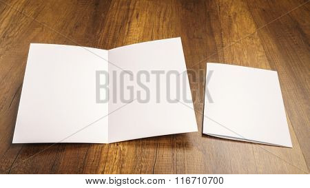 Bifold white template paper on wood texture