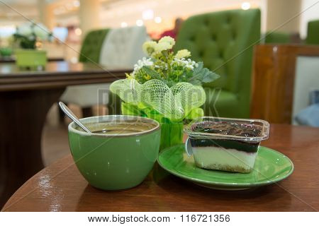 Cup Of Art Espresso And Cake On Desk
