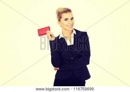 Happy smiling businesswoman with red wallet