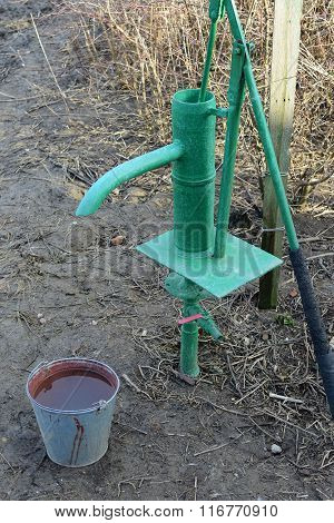 Hand Pump Leading To An Artesian Well.