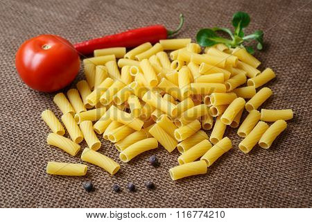 Rigatoni Raw Pasta On Background Of Jute