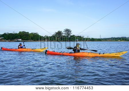 Group of adventurer enjoying sea kayak expedition activity.