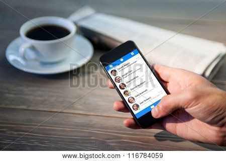 Smartphone app menu against close up of person using smartphone