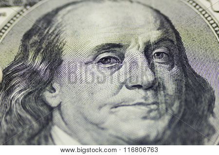 One hundred dollars close up as background