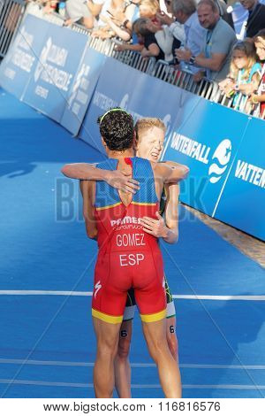 Triathlete Javier Gomez Hugging Henri Schoeman After The Finish