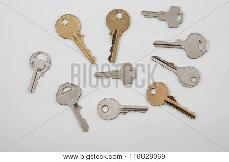 Assortment Of Keys On Plain Background