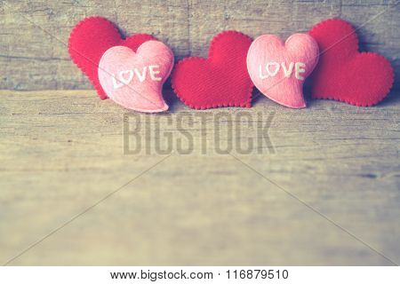Valentines Day Background With Red And Pink Hearts On Wooden Background. Vingtage Tone.