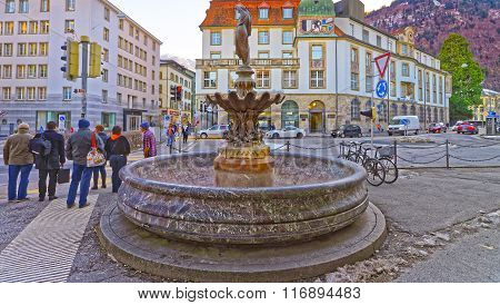 CHUR SWITZERLAND - JANUARY 5 2015: Fountain with woman statue in the Old Town of Chur. Chur is the capital of canton Graubunden in Switzerland. It lies in Alpine Grisonian Rhine valley. The city is the oldest town of Switzerland