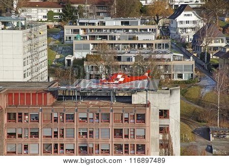 Helicopter Landing On The Hospital Roof In Thun City