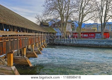 Fragment of Old Wooden Sluice bridge in the Old Town of Thun. Thun is a city in Swiss canton of Bern where Aare river flows out of Lake Thun.