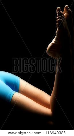 Woman In Blue Shorts Lay Legs With Toes Up Highlighted