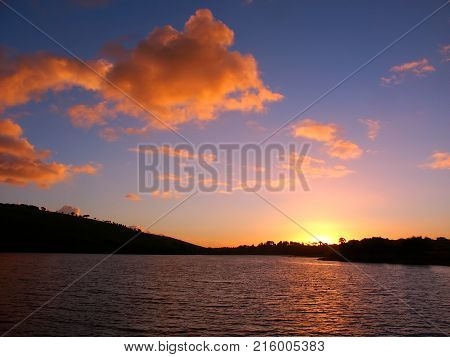 Sunset over small waves on the Hopkins River near Warrnambool of Victoria Australia