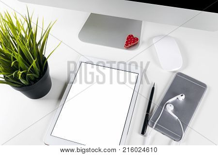 Tablet computer PC with blank screen mock up business office table. Tablet computer isolated white screen. Tablet white screen with copy space. Empty space for text.