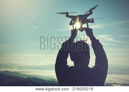 drone pilotage at sunrise over the fog.