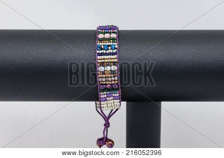 one side of a colorful hand stitched flat beaded bracelet