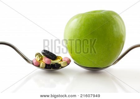 Spoon With Apple Vs Spoon With Pills.