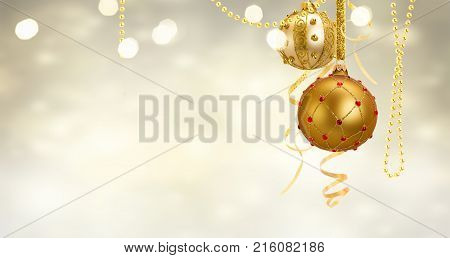 Golden christmas balls garland and evergreen fir tree on glowing golden background banner