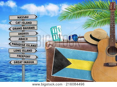Concept of summer traveling with old suitcase and Bahamas