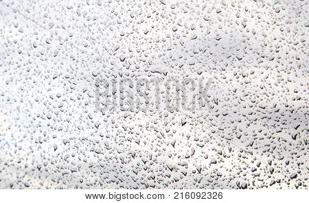 a lot of drops on the glass close up.
