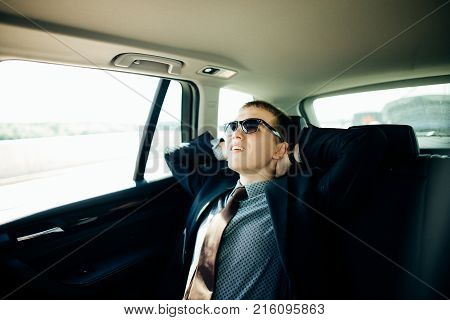 cockpit of car. a vehicle running self driving mode and a man driver being relaxed.