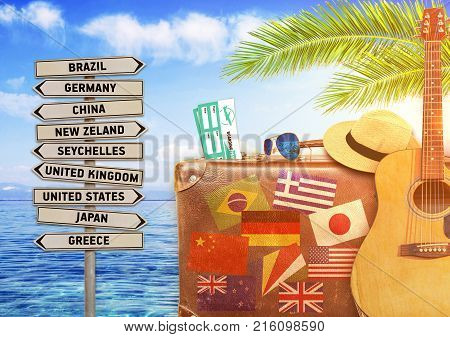 Concept of summer traveling with old suitcase and burning sun