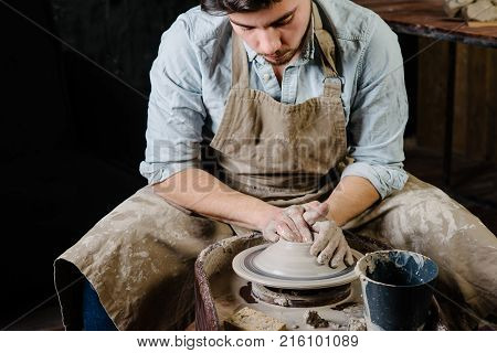 Handsome Young Mexican Potter Does Sketches Of Ceramics On The Paper. Concept Of Small Business, Han