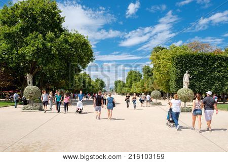 PARIS,FRANCE - JULY 29,2017 : Parisians enjoying summer at the Tuileries Garden in Paris