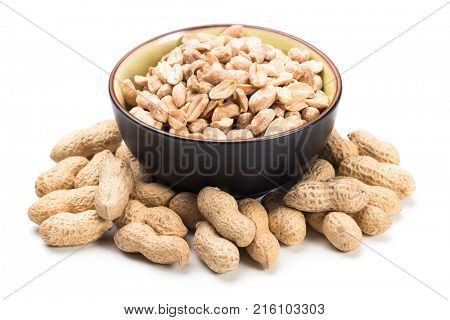 Roasted peanuts with peanut shells isolated on white background