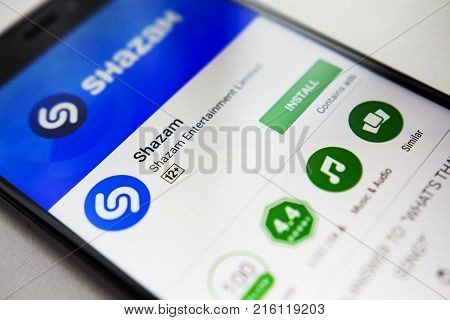 Berlin Germany - November 19 2017: Shazam application on screen modern smartphone in Play Store. Shazam app