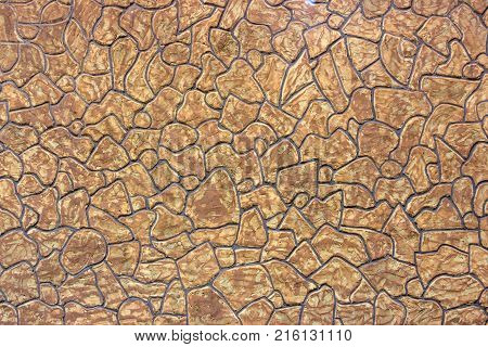 Decorative brick wall from concrete facing tiles as background or texture.