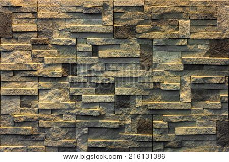 Decorative brick wall from concrete facing tiles as background or texture.