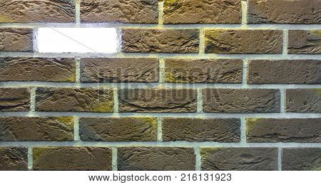 Decorative brick wall from concrete facing tiles as background or texture.