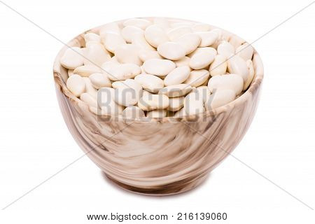 White beans in a pial plate on a white background isolation