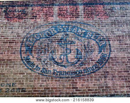 San Francisco - April 7 2010: Old Anchor Steam Beer Logo on Red Brick Wall located in San Francisco California in the Potrero Hill district. Established brewery offers historic walking tours of the building followed by a tasting session.