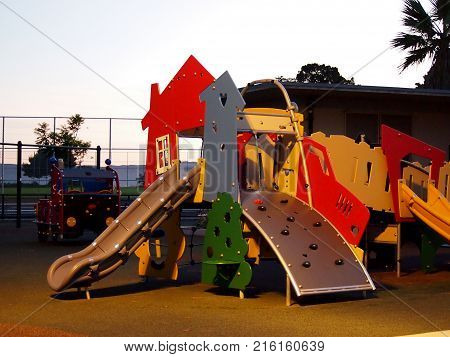 San Francisco - November 7 2011: Kids play structure featuring a slide that looks like a house and truck at Potrero Hill Recreation Center in San Francisco California at dusk.