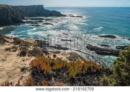 Beach with rocks in Praia do Cavaleiro in Alentejo, Portugal