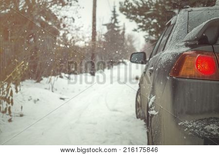 Car on empty snowy road. Travelling concept.