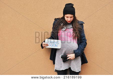 Pregnant woman. Pregnancy. A photo of a cute caucasian pregnant woman.