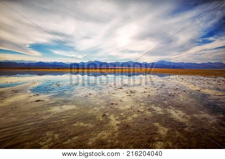 Low tide in the Nabq national park. Mountains on the horizon at sunset.