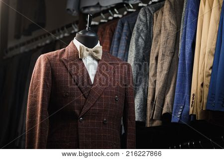 Stylish men's suit. Men's jacket on a mannequin. Men's Clothing. Mannequins in the window of the boutique. Clothing store. Shopping in boutiques.