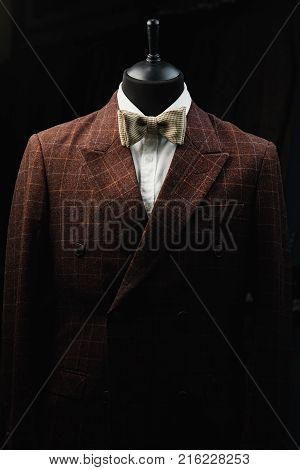 Stylish men's suit. Men's jacket on a mannequin. Men's Clothing. Mannequins in the window of the boutique. Clothing store. Shopping in boutiques.