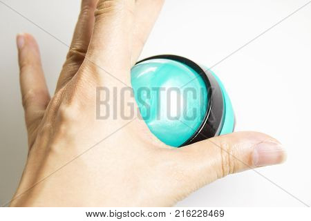 Woman hand holding rollon ball for relaxing body massage