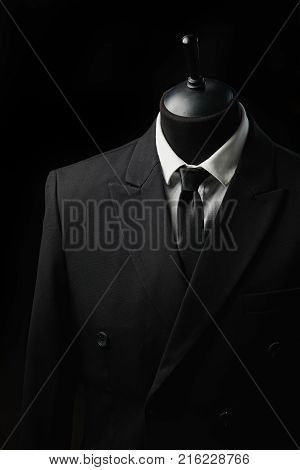 Stylish men's suit. Men's jacket on a mannequin. Men's Clothing. Mannequins in the window of the boutique. Clothing store. Shopping in boutiques.