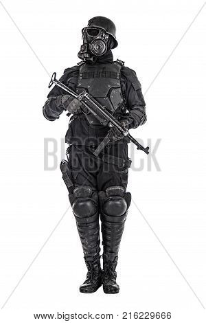 Futuristic nazi soldier gas mask and steel helmet with schmeisser handgun isolated on white studio shot standing to attention