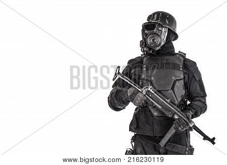 Futuristic nazi soldier gas mask and steel helmet with schmeisser handgun isolated on white studio shot half length portrait