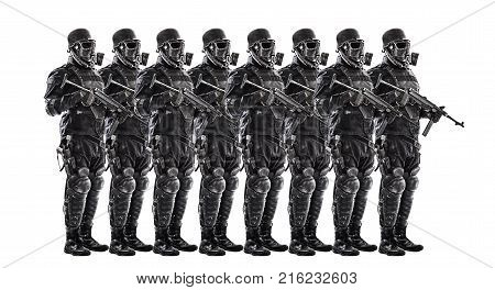 Line of futuristic nazi soldiers in gas mask and steel helmet with schmeisser handgun isolated on white studio shot full length portrait