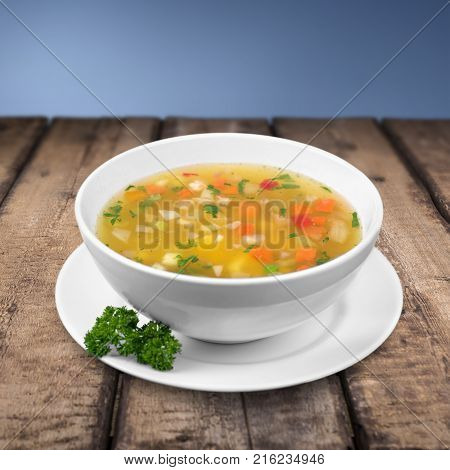 Delicious bowl soup healthy eating table color background
